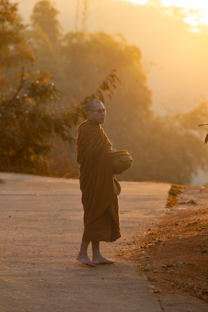 Monk collecting alms