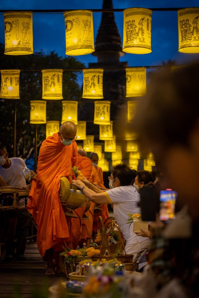 Giving alms to Buddhist monks in Sukhothai